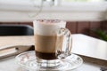 Cup of cappuccino coffee, hot mocha drink with cinnamon and coco Royalty Free Stock Photo