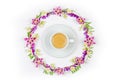 Cup of cappuccino coffee in a round vintage floral frame of Jasmine flowers and wildflowers on a white background top view close-u Royalty Free Stock Photo