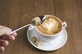 Cup of cappuccino with milk foam in heart shape Royalty Free Stock Photo