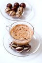Cup of cappucino and candies Royalty Free Stock Photo