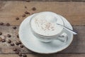 A cup of Capuchino coffee in a white cup Royalty Free Stock Photo