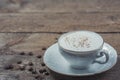A cup of Capuchino coffee in a white cup Royalty Free Stock Photo