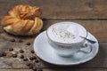 A cup of Capuchino coffee in a white cup Royalty Free Stock Photo