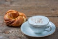 A cup of Capuchino coffee in a white cup Royalty Free Stock Photo