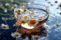 A cup of chamomile tea with a teabag and chamomile flowers floating on the surface, representing relaxation, wellness, and herbal