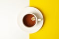 Cup chamomile tea on two tone background, top view Royalty Free Stock Photo