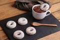 Cup of chocolate with homemade bagels on black tray