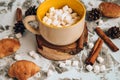 A cup of Christmas New Year delicious hot chocolate and cocoa with marshmallows sprinkled with cocoa powder, cones and croissants Royalty Free Stock Photo