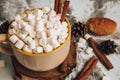 A cup of Christmas New Year delicious hot chocolate and cocoa with marshmallows sprinkled with cocoa powder, cones and croissants Royalty Free Stock Photo