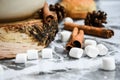 A cup of Christmas New Year delicious hot chocolate and cocoa with marshmallows sprinkled with cocoa powder, cones and croissants Royalty Free Stock Photo