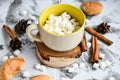 A cup of Christmas New Year delicious hot chocolate and cocoa with marshmallows sprinkled with cocoa powder, cones and croissants Royalty Free Stock Photo