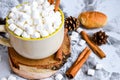 A cup of Christmas New Year delicious hot chocolate and cocoa with marshmallows sprinkled with cocoa powder, cones and croissants Royalty Free Stock Photo