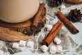 A cup of Christmas New Year delicious hot chocolate and cocoa with marshmallows sprinkled with cocoa powder, cones and croissants Royalty Free Stock Photo