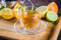 Cup of Citrus tea on wooden tray on blue stone table. Still life. Drink Healthcare Cold Concept Royalty Free Stock Photo
