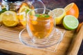 Cup of Citrus tea on wooden tray on blue stone table. Still life. Drink Healthcare Cold Concept