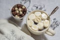A cup of cocoa with marshmallows and corn balls on a white background Royalty Free Stock Photo