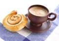 Cup of cofee with cinnamon Danish bun