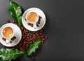 Cup of coffe with coffee beans and green leaves on black background Festive AI Generated Royalty Free Stock Photo