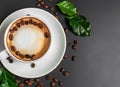 Cup of coffe with coffee beans and green leaves on black background Festive AI Generated Royalty Free Stock Photo