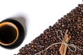 Cup of coffe, grains of coffee and cinnamon on a white background Royalty Free Stock Photo
