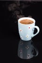 Cup of coffee above black background with reflections Royalty Free Stock Photo