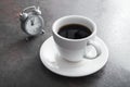 Cup of coffee with alarm clock Royalty Free Stock Photo