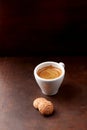 Cup of coffee with amaretti Italian biscuits on rustic wooden background Royalty Free Stock Photo