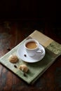 Cup of coffee with amaretti Italian biscuits on rustic wooden background. Royalty Free Stock Photo