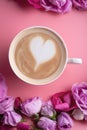 Cup of coffee around may roses against pink background. romantic and beauty concept  . close up Royalty Free Stock Photo