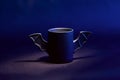 Cup of coffee as bat for Halloween on black background. Blue light and shadow. Toy . concept Royalty Free Stock Photo