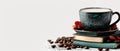 A cup of coffee atop books, near a pile of beans - coffee and beans Royalty Free Stock Photo