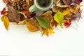 Cup of coffee with autumn decoration from dry colored leaves Royalty Free Stock Photo