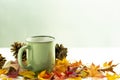 Cup of coffee with autumn decoration from dry colored leaves Royalty Free Stock Photo