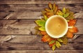 Cup of coffee with autumn decoration from dry colored leaves on Royalty Free Stock Photo