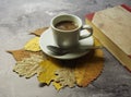 A cup of coffee and leaves