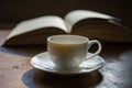 Cup of coffee on the background of an open book. Royalty Free Stock Photo