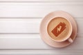 Cup of coffee with battery energy on foam Royalty Free Stock Photo