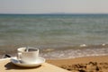 Cup of coffee at the beach Royalty Free Stock Photo