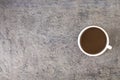 Cup of coffee, coffee beans against concrete background Royalty Free Stock Photo