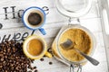 Cup of coffee and coffee beans and cane sugar Royalty Free Stock Photo