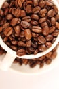 Cup of coffee beans Royalty Free Stock Photo