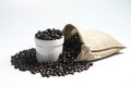 Cup Coffee beans in Cloth bag on White background. Royalty Free Stock Photo