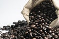 Cup Coffee beans in Cloth bag on White background. Royalty Free Stock Photo