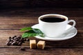 Cup of coffee with beans, leaf and sugar Royalty Free Stock Photo