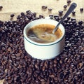Cup of coffee and beans in sack Royalty Free Stock Photo