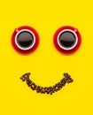 Cup of coffee and coffee beans with smile face concept, Top view on yellow background. For morning happy concept Royalty Free Stock Photo