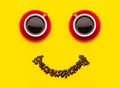Cup of coffee and coffee beans with smile face concept, Top view on yellow background. For morning happy concept Royalty Free Stock Photo