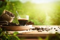 Cup of coffee and beans on table in crop field Royalty Free Stock Photo