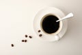 Cup of coffee and beans on white background top view Royalty Free Stock Photo