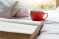 A cup of coffee on bed with copy space